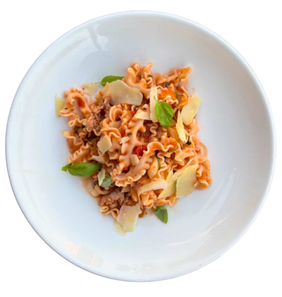 Handcrafted mafaldine pasta ribbons served with a vibrant, fresh tomato sauce.